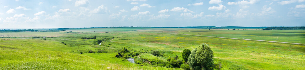 Fototapeta na wymiar Wonderful summer panoramic view of fields and motorway