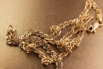 gold chain on the golden background