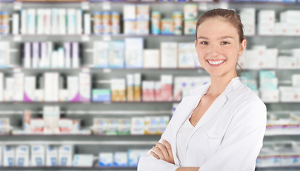 Young pharmacist in pharmacy - obrazy, fototapety, plakaty
