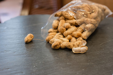 Pile of peanut on black stone table