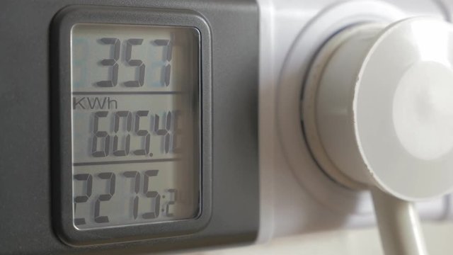 Power meter measuring power consumption 4K 3840X2160 UHD footage - Electric power measure on digital current meter 4K 2160p UHD video 