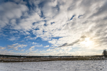 Beautiful cloudy and blue sky panorama over ice lake