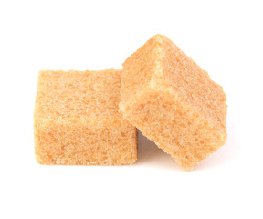Cubes of cane sugar isolated on white background