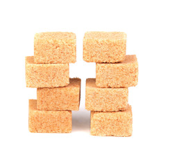 Cubes of cane sugar isolated on white background