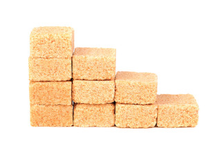 Cubes of cane sugar isolated on white background