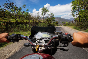 Motorbiker travelling in mountains