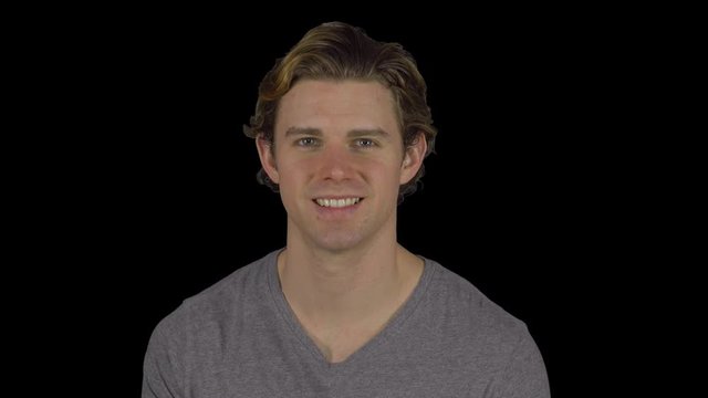 Friendly happy guy turns and smiles (Transparent Background)