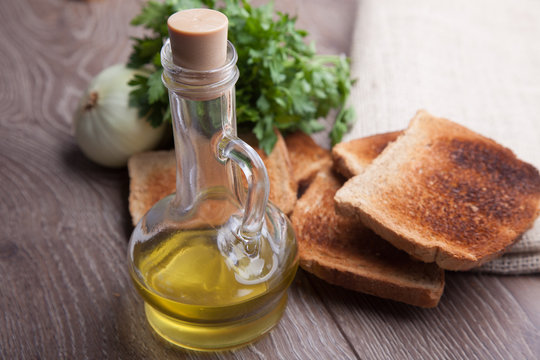 olive oil on table with bread
