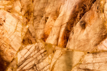 detail of a translucent slice of natural quartz agate marble stone. natural patterns, textures and background. natural stone agate surfaces, backgrounds and wallpapers. abstract background