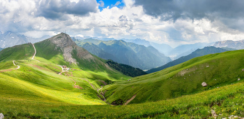 Fototapeta na wymiar Panorama dal Col Rodella sulle Dolomiti della Val di Fassa con il ghiacciaio della Marmolada sullo sfondo