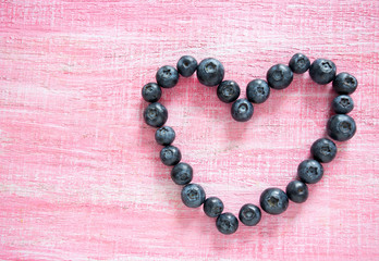 blueberries on wooden surface