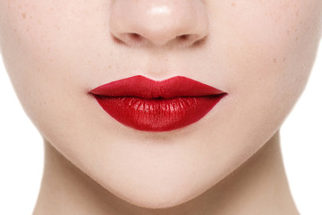 Part of attractive woman's face with fashion red lips makeup.