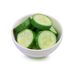 Fresh slice cucumber in white bowl on white background
