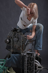 girl in engine oil with wrench key