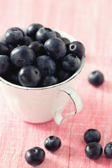 blueberries on wooden surface