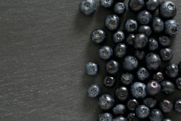blueberries on stone board