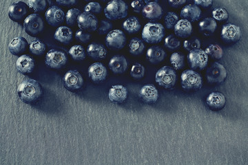 blueberries on stone board