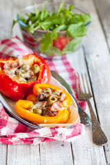 Stuffed peppers with meat, olives and bacon