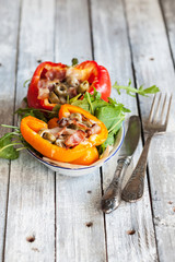 Stuffed peppers with meat, olives and bacon