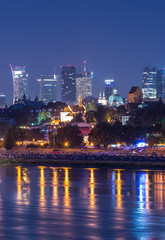 Fototapeta na wymiar Night view of Warsaw waterfront and downtown skyline