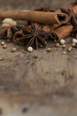 Fototapeta na wymiar Spices lying on a wooden surface closeup