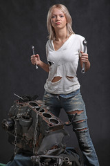 girl in engine oil with wrench key