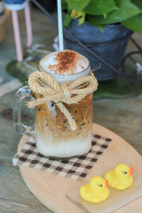Iced coffee with milk in glass
