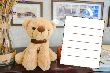 Postcard, bear doll and blank message box