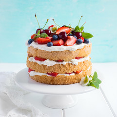summer sponge cake with cream and fresh berries