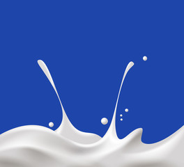 milk splash on blue background