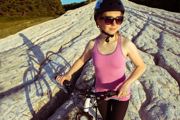 young woman rider bike outdoors