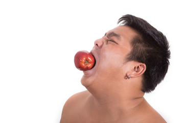 fat man with a apple in his mouth