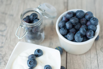 blueberries yogurt on old wooden vintage floor