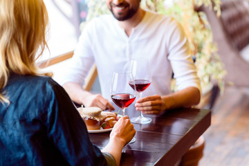 Carefree man and woman resting in cafe