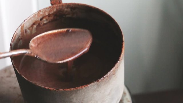 Making chocolate dough for brownie - stirring cocoa dough mixture
