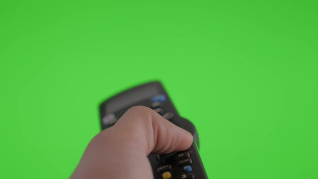 Remote control channel changing on green screen 4K 3840X2160 UltraHD footage - TV infra red remote control using in front of greenscreen display 4K 2160p UHD video 