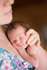 mother holding newborn