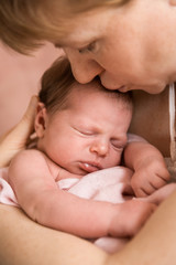 mother holding newborn