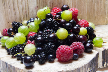Mixed berries.  and wooden background.