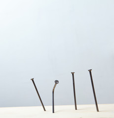 nails on the wood panel