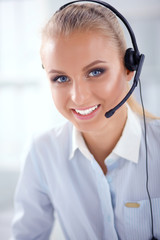 Close-up portrait of a customer service agent sitting at office