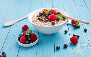 Healthy breakfast - porridge with berries