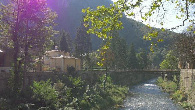 River Cerna and beautiful bridge scenery of spa resort Herculane located in western Romania - Scenery in nature of spa resort Herculane Romania 4K 3840X2160 UHD video 