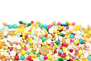 Fototapeta na wymiar Colored pills on a white background