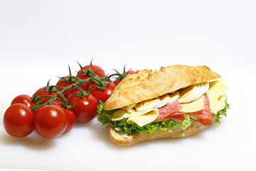 Baguette bun, salami, cheese, lettuce and boiled eggs
