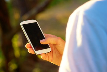 Man with smartphone in the hand using social networks