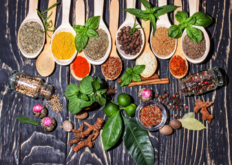 Colorful aromatic  spices and herbs on  wooden brown backgrownd