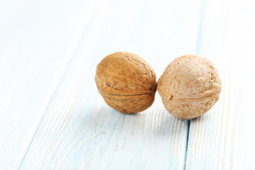 Walnuts on a blue wooden table