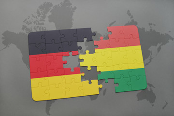 puzzle with the national flag of germany and bolivia on a world map background.