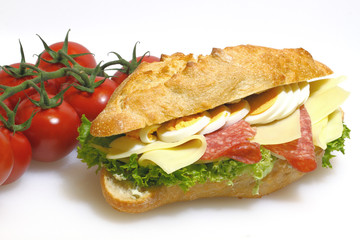 Baguette bun, salami, cheese, lettuce and boiled eggs